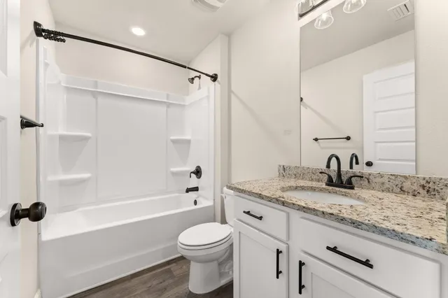 an empty room with a ceiling fan