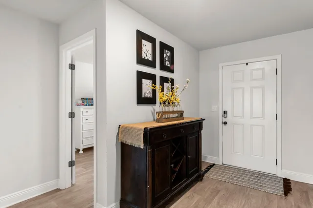 a room with a bed and a mirror