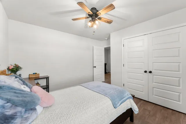 a bedroom with a bed and closet