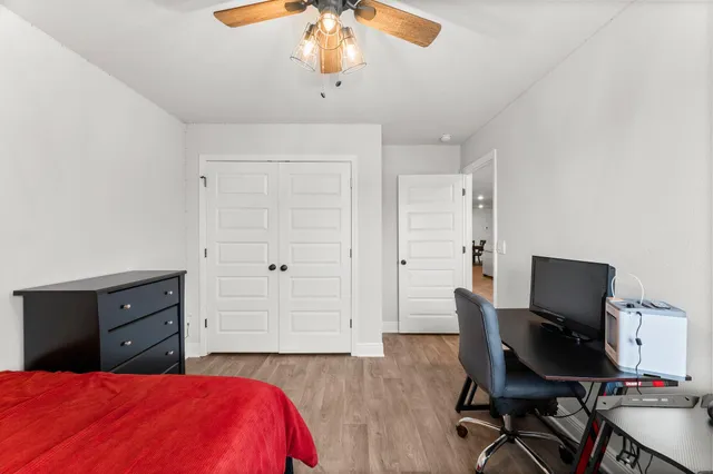 a bed room with a bed and a desk