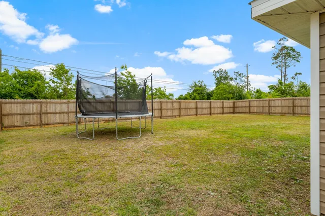 a garden view with a playing court