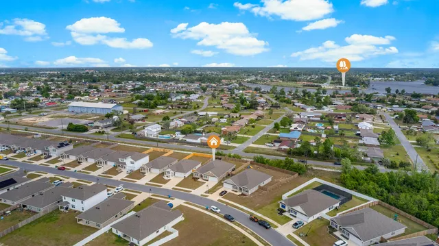 an aerial view of residential building with parking space
