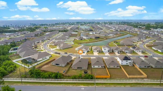 an aerial view of residential houses with outdoor space