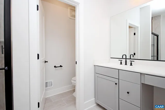 a bathroom with a sink and mirror
