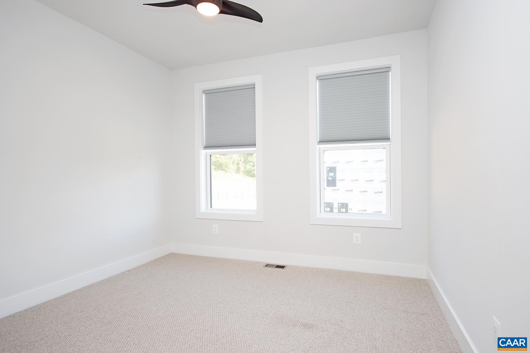 806 Wesley Lane, Unit B Charlottesville, VA 22911 - Photo 14 of 20 an empty room with a window