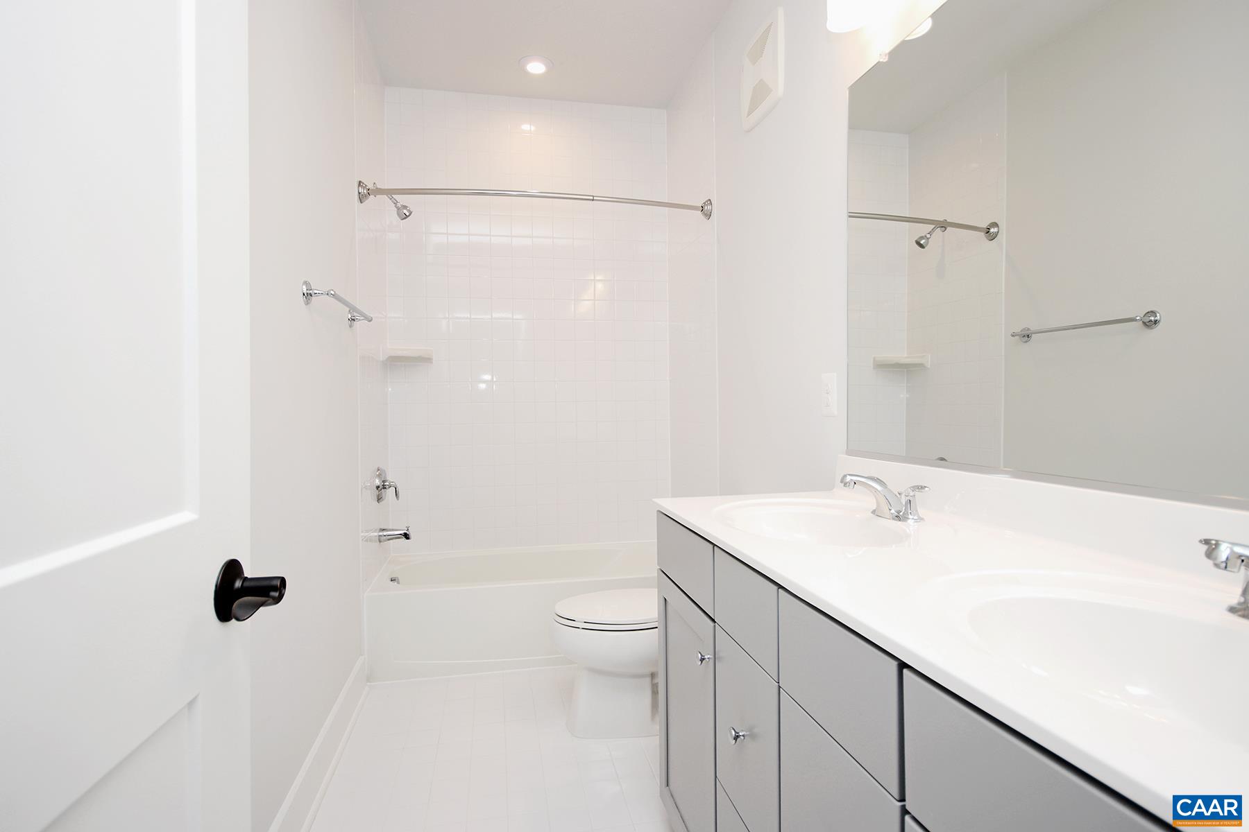 806 Wesley Lane, Unit B Charlottesville, VA 22911 - Photo 18 of 20 a bathroom with a sink a toilet and shower