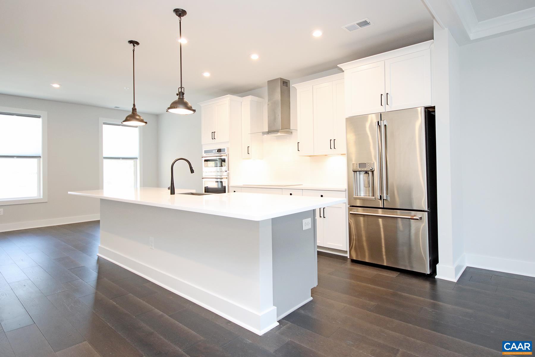 806 Wesley Lane, Unit B Charlottesville, VA 22911 - Photo 4 of 20 a kitchen with stainless steel appliances a refrigerator and a sink
