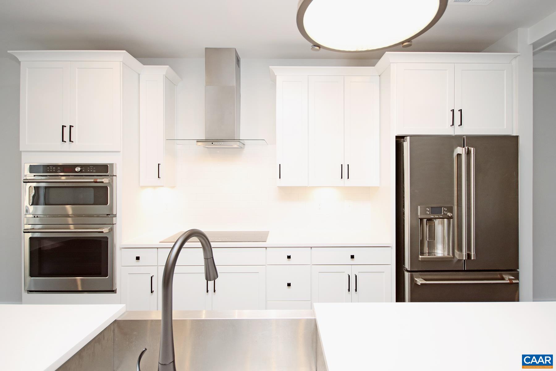 806 Wesley Lane, Unit B Charlottesville, VA 22911 - Photo 5 of 20 a kitchen with granite countertop a refrigerator and a stove