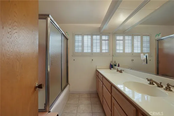 a bathroom with a sink and a large mirror