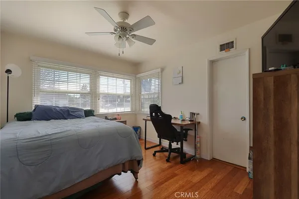 a bedroom with a bed and a table