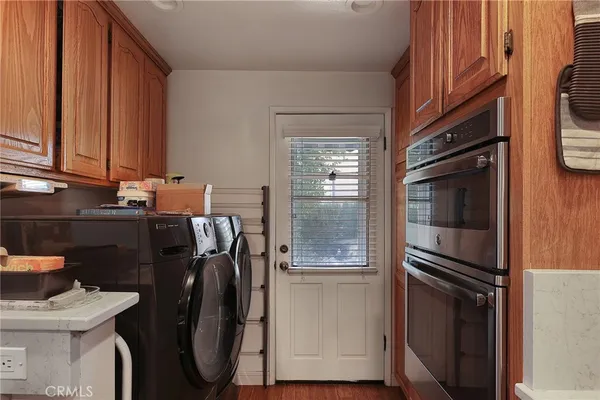 a kitchen with a refrigerator and a stove