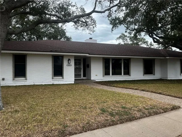 a house with trees in the background