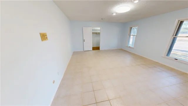 an empty room with windows