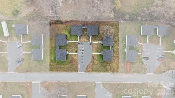 a view of a backyard with sitting area