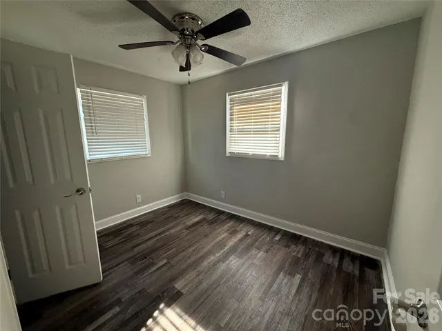 a view of road with residential houses