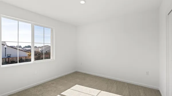 a view of empty room with windows