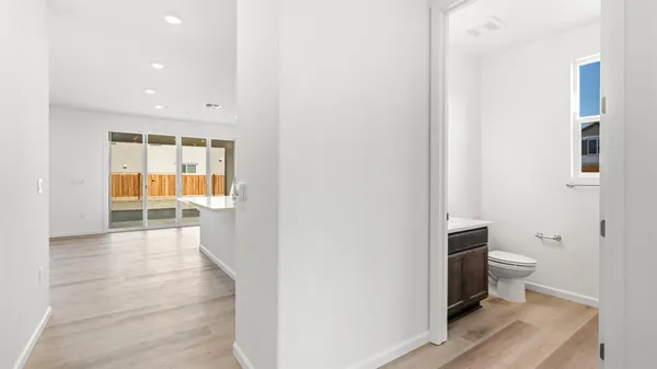 a bathroom with a toilet and a bathtub