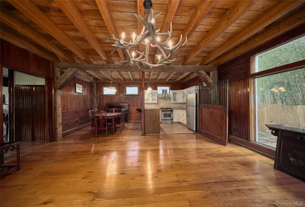 a view of a hall with wooden floor