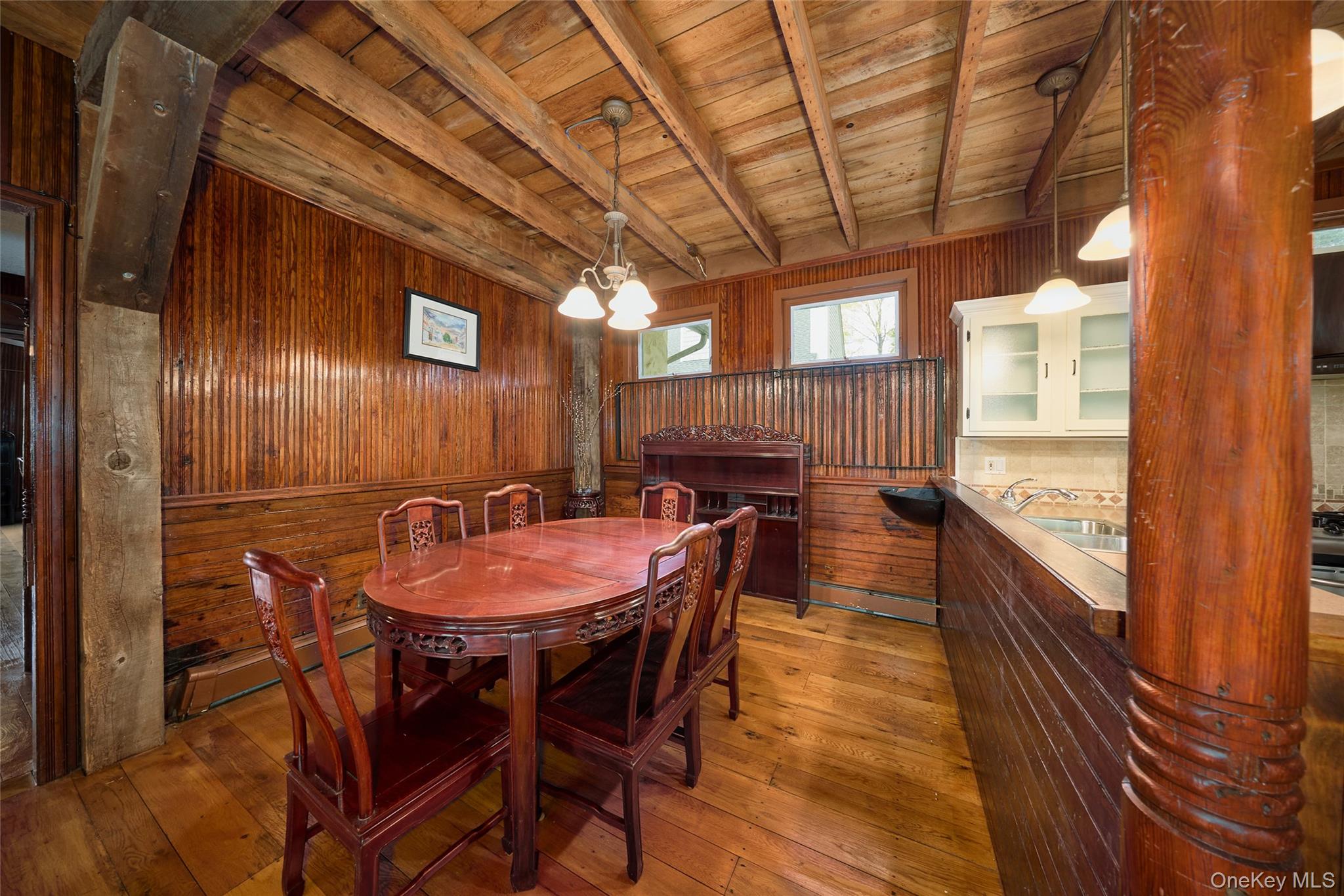 6 Stable Road Tuxedo Park, NY 10987 - Photo 12 of 28 a dining room with a wooden table and chairs