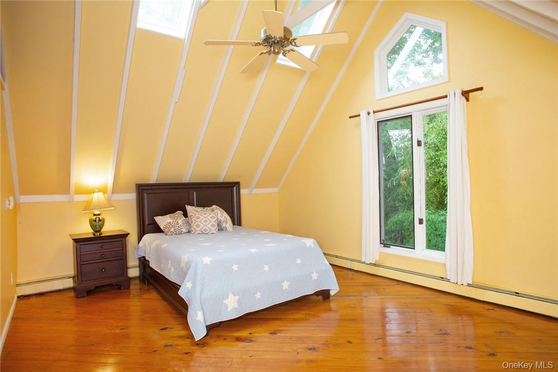 6 Stable Road Tuxedo Park, NY 10987 - Photo 16 of 28 a bedroom with a bed and a window