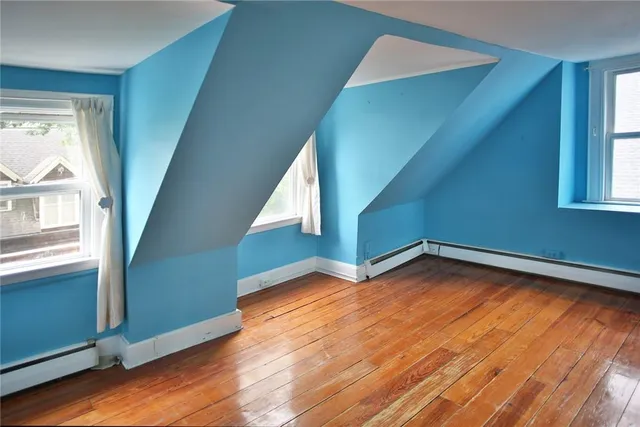 a view of lobby with furniture and wooden floor