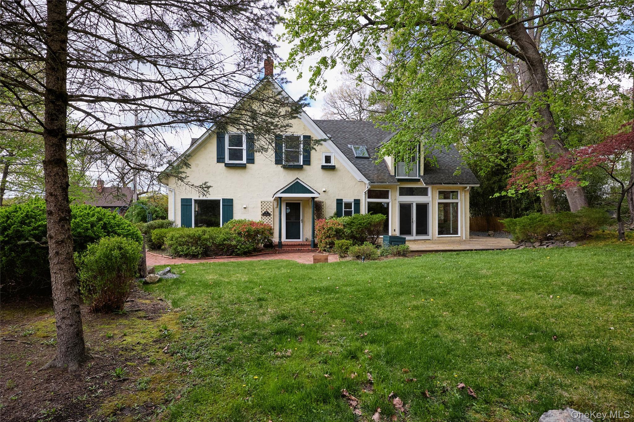 6 Stable Road Tuxedo Park, NY 10987 - Photo 26 of 28 a front view of a house with a yard and porch