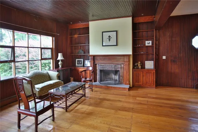 a living room with furniture and a fireplace