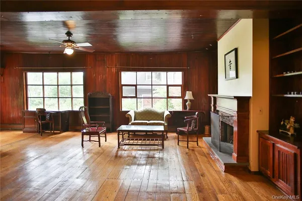 a living room with furniture and a fireplace