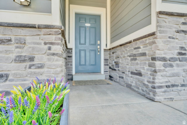 3269 West 650 North Layton, UT 84041 - Photo 5 of 35 Stone veneer facade with light blue entry door