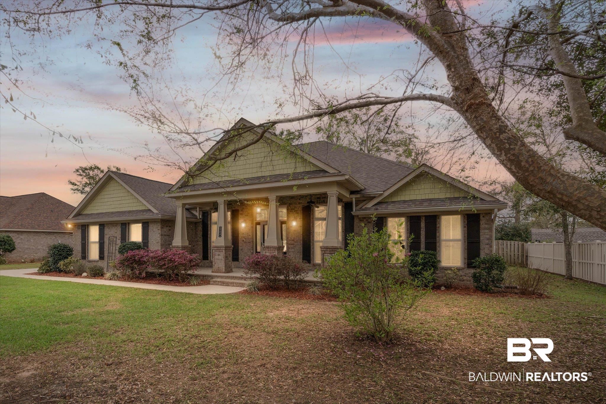 704 Edinburgh Avenue Foley, AL 36535 - Photo 2 of 32 Craftsman house with a porch, brick siding, and roof with shingles