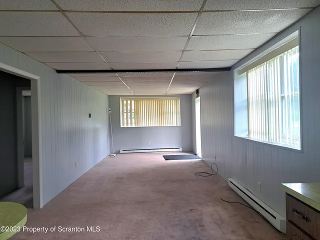 a view of an empty room with a window