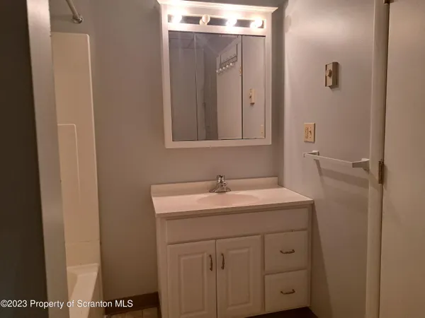 a bathroom with a sink and mirror