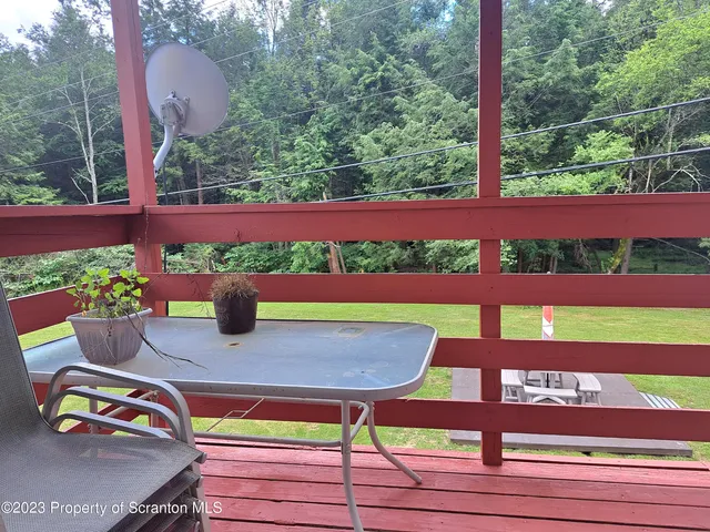 a view of small yard with wooden floor