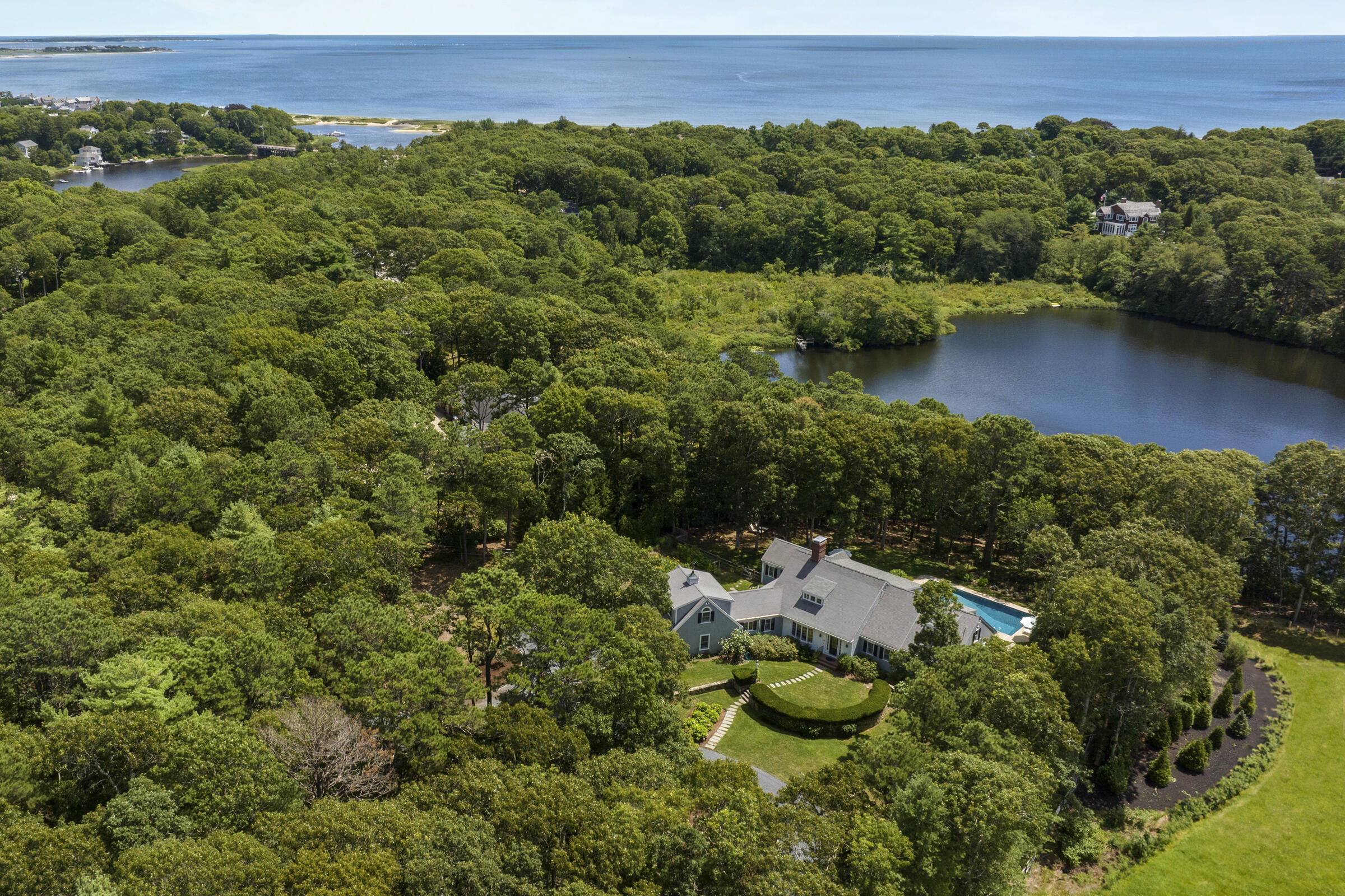 an aerial view of a house with a yard