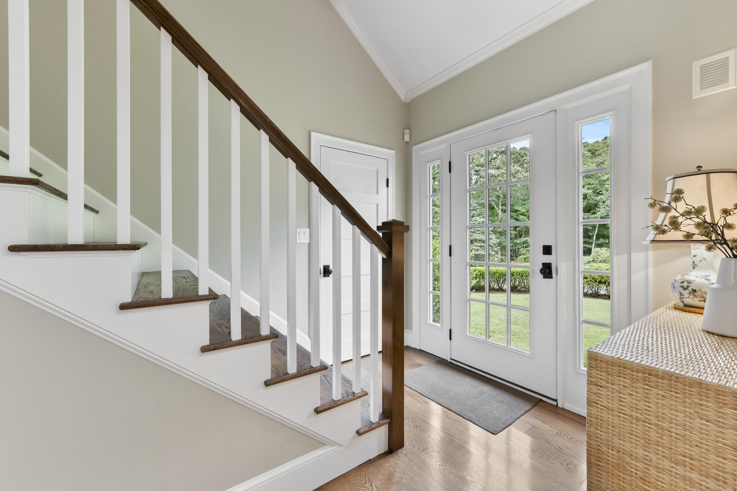 175 Starboard Lane Osterville, MA 02655 - Photo 12 of 39 a view of staircase with lots of frames on wall and a hard wood floor