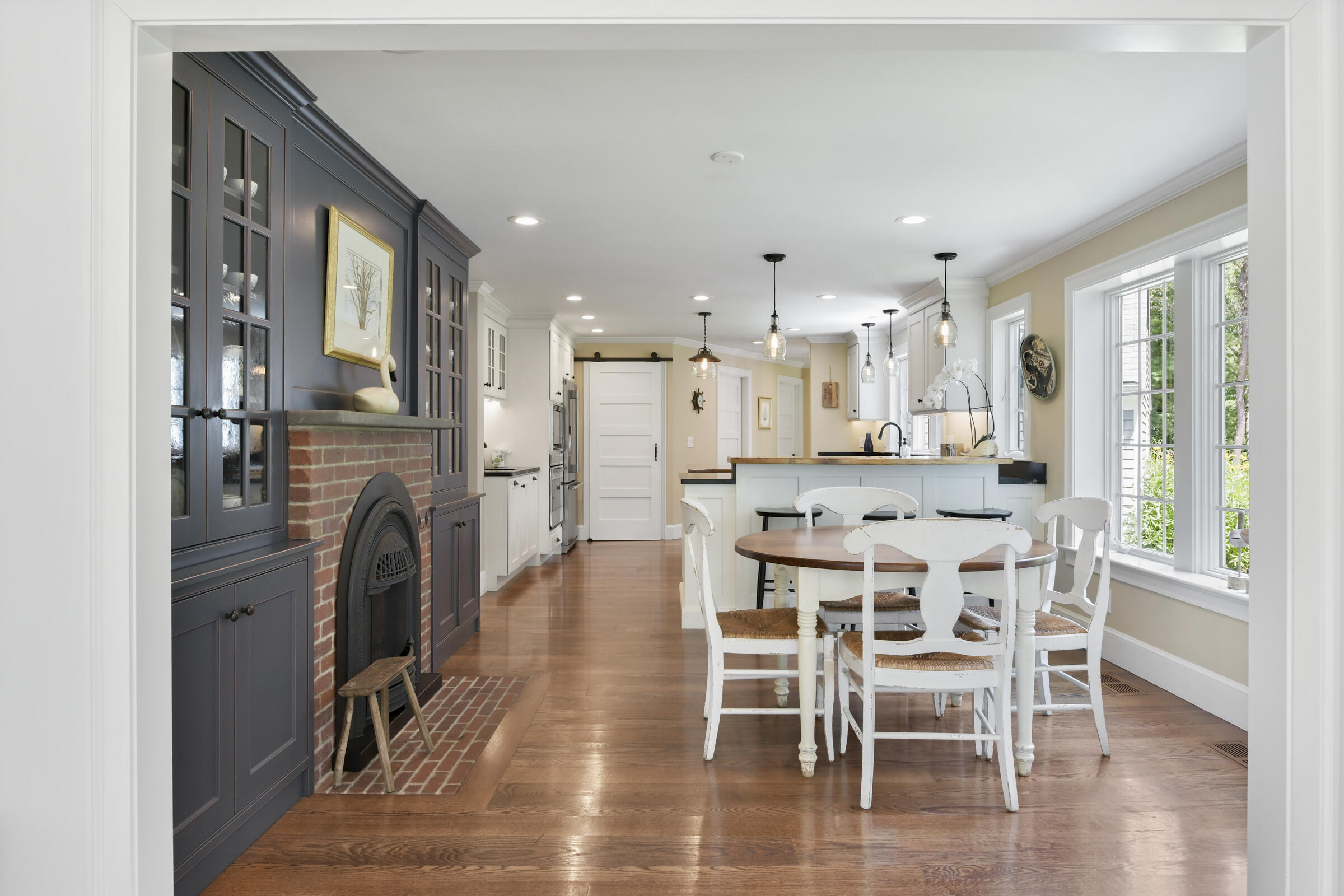 175 Starboard Lane Osterville, MA 02655 - Photo 22 of 39 a dining room with stainless steel appliances kitchen island granite countertop a dining table chairs and a refrigerator