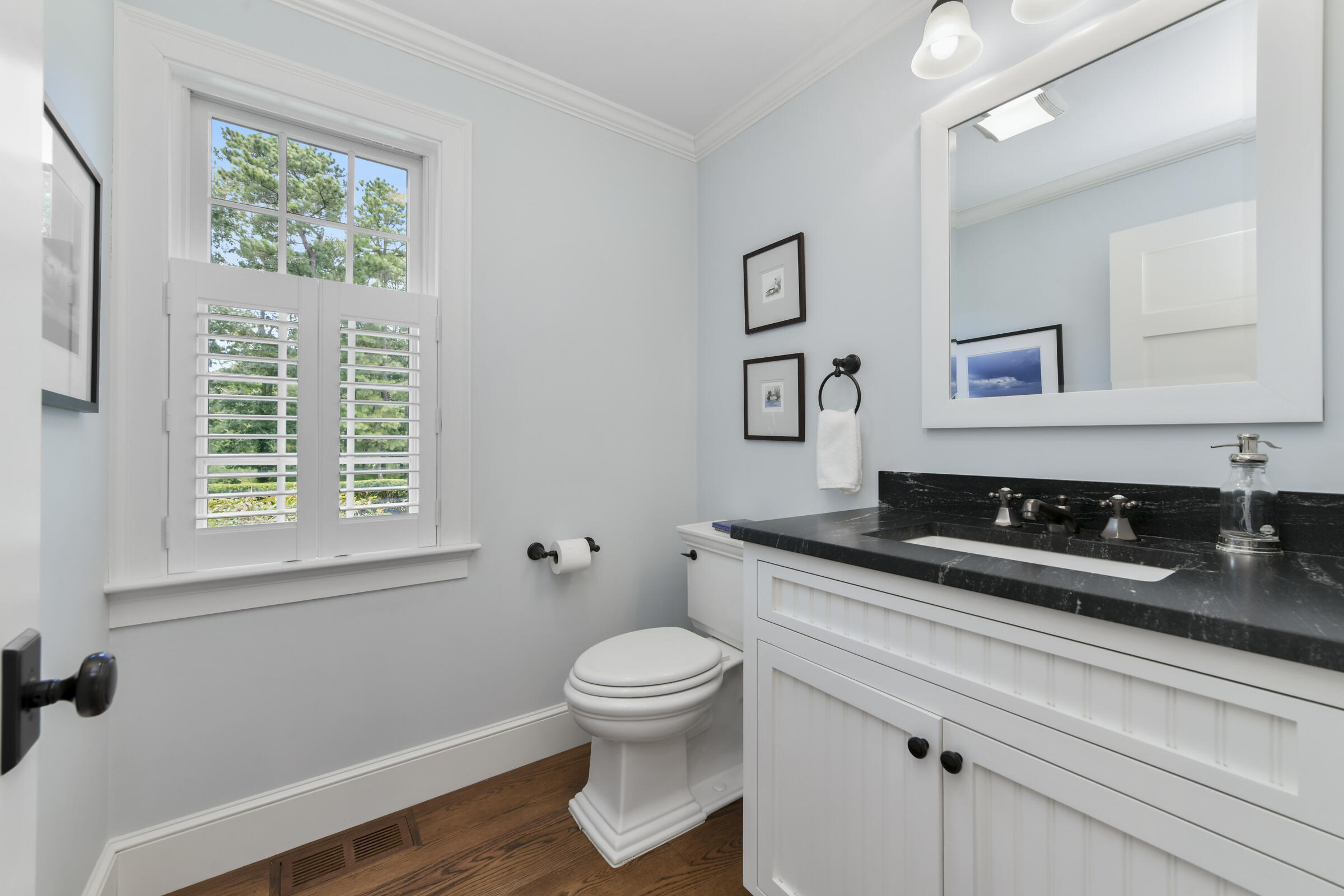 175 Starboard Lane Osterville, MA 02655 - Photo 23 of 39 a bathroom with a granite countertop sink a toilet a mirror and a window