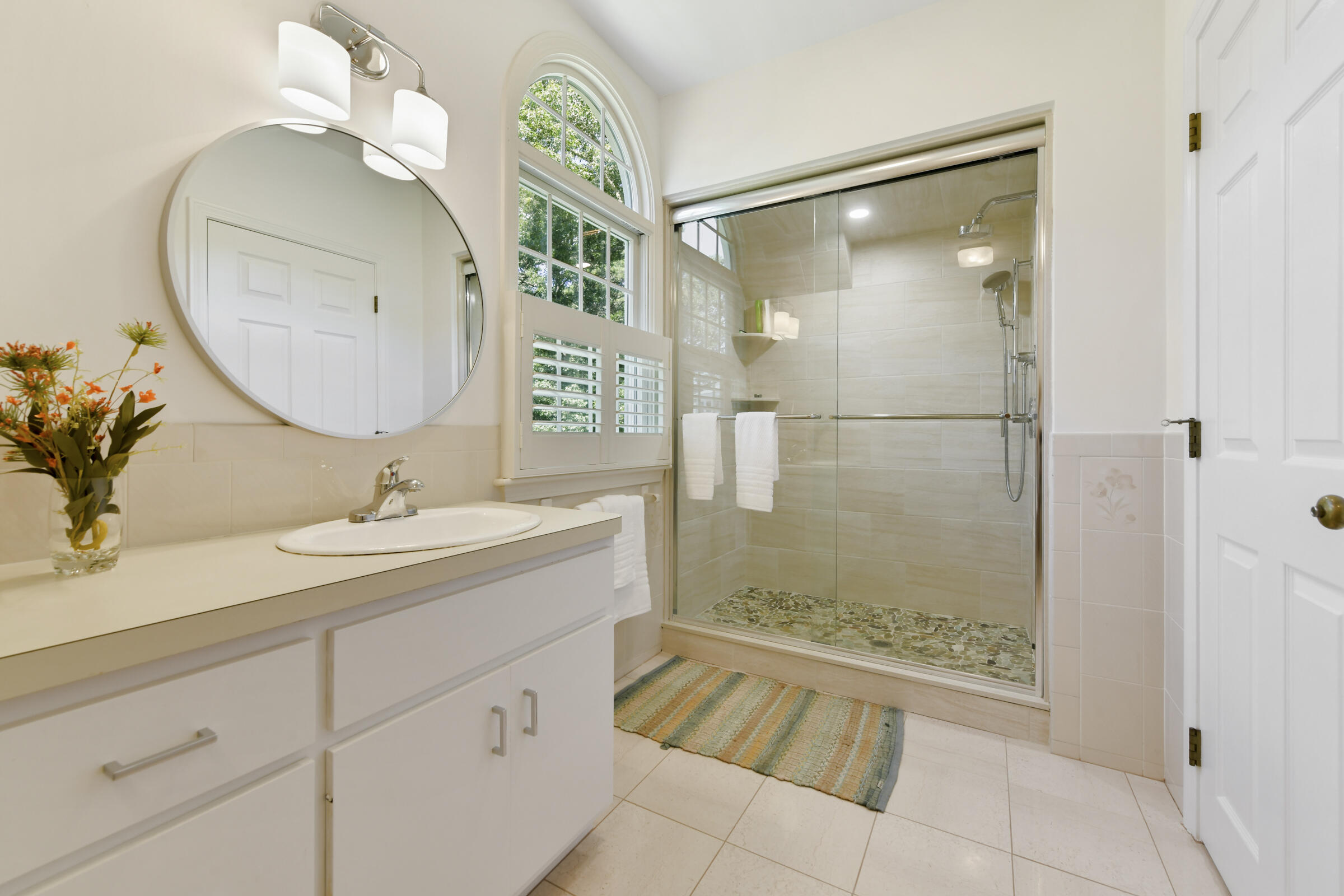 175 Starboard Lane Osterville, MA 02655 - Photo 39 of 39 a bathroom with a granite countertop sink mirror and shower