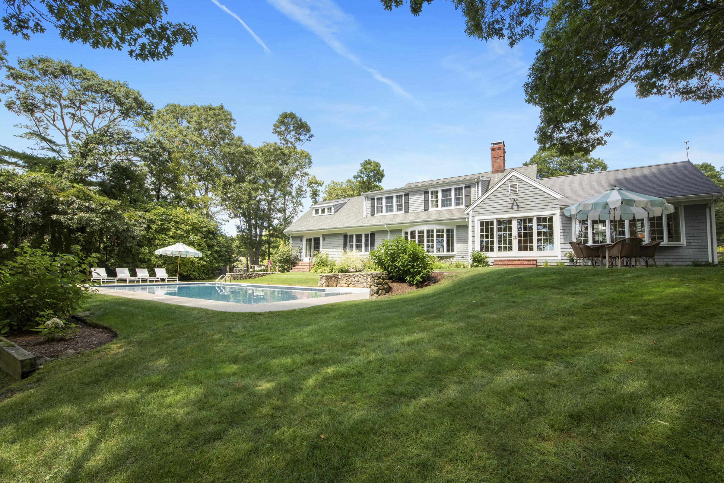 175 Starboard Lane Osterville, MA 02655 - Photo 8 of 39 a view of a house with a yard table and chairs
