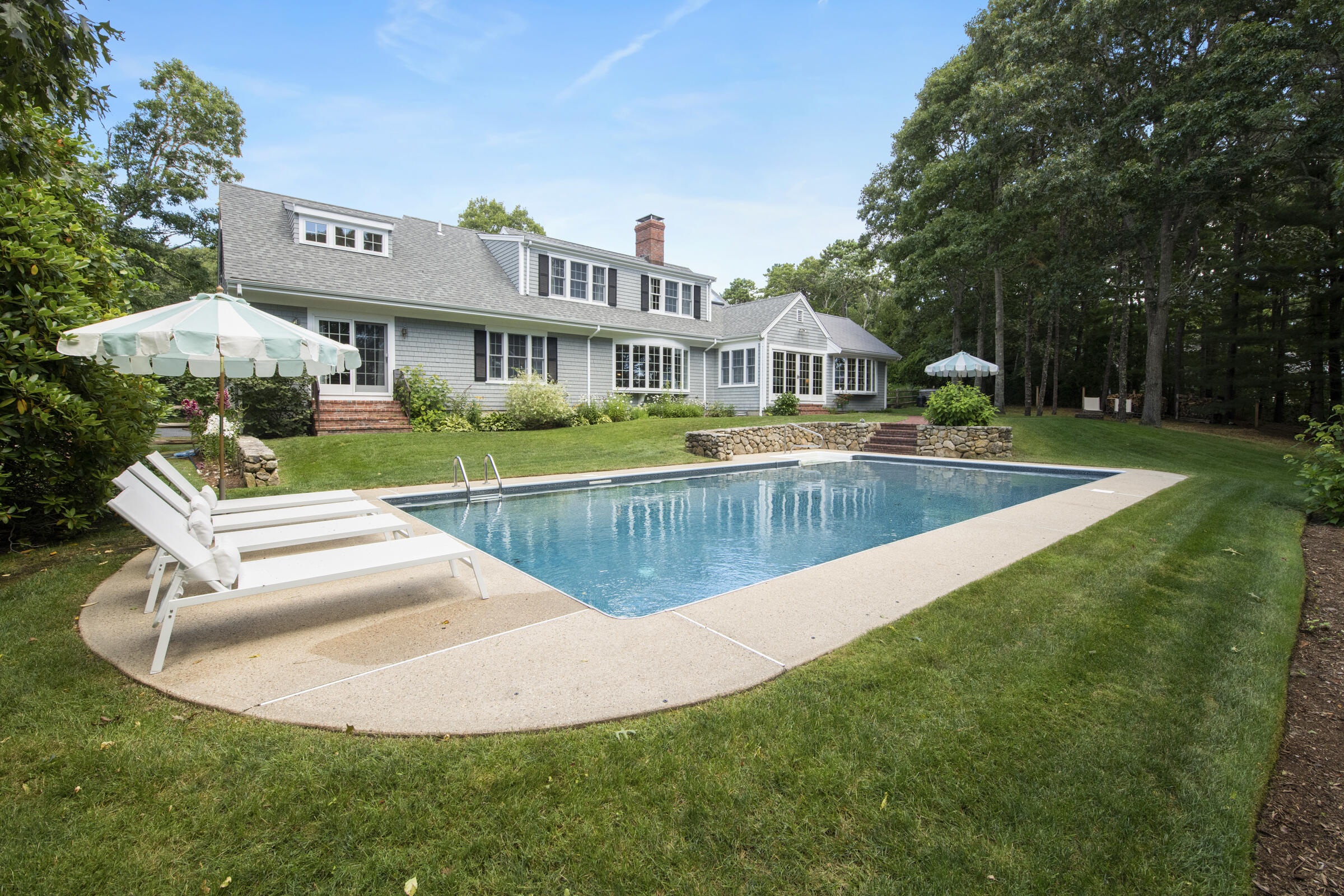 175 Starboard Lane Osterville, MA 02655 - Photo 9 of 39 a view of a house with a big yard and sitting area