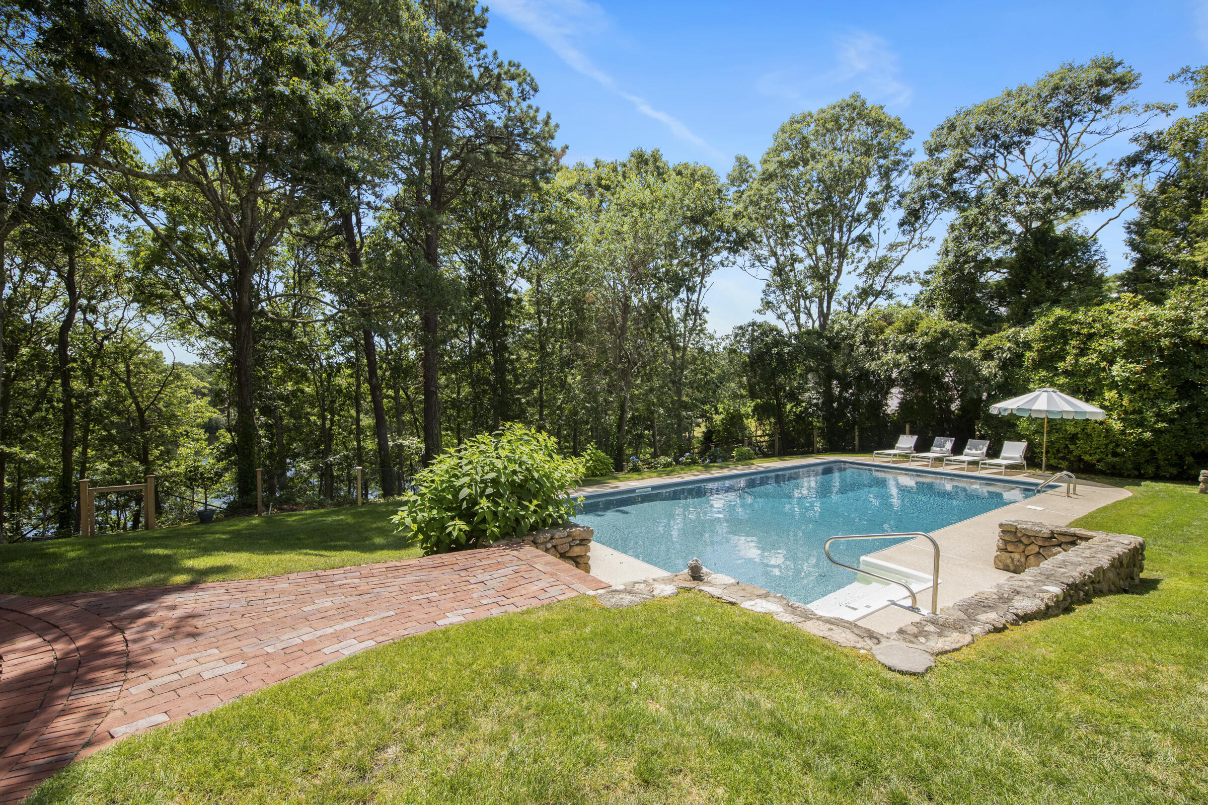 175 Starboard Lane Osterville, MA 02655 - Photo 10 of 39 a view of a backyard with large trees