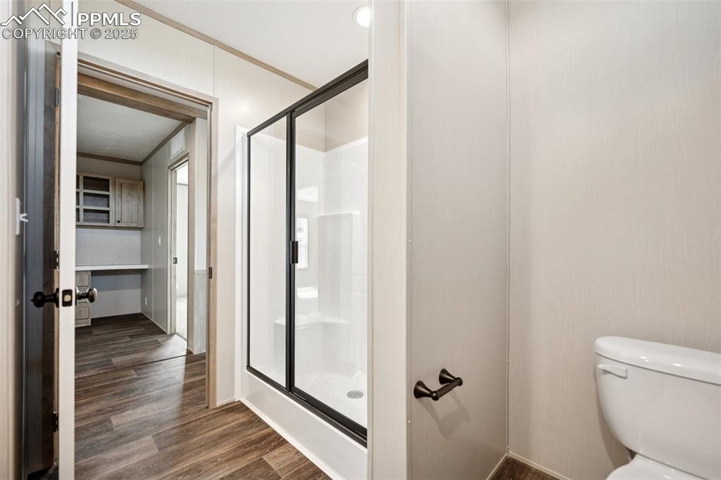 30495 Darroll Drive Yoder, CO 80864 - Photo 15 of 34 a bathroom with a glass shower door