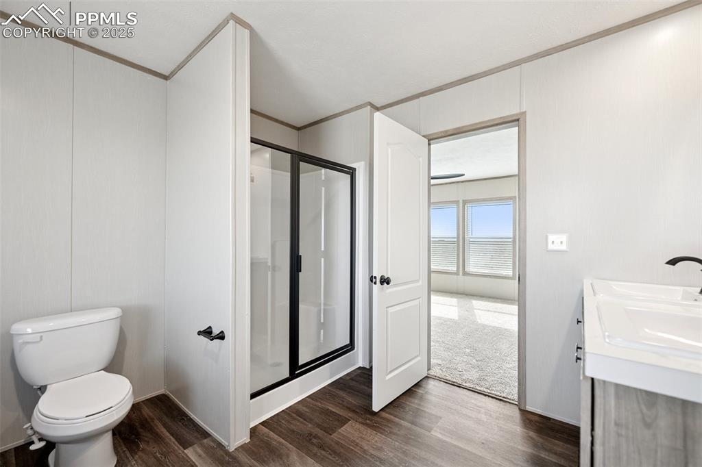 30495 Darroll Drive Yoder, CO 80864 - Photo 16 of 34 a bathroom with a glass shower door