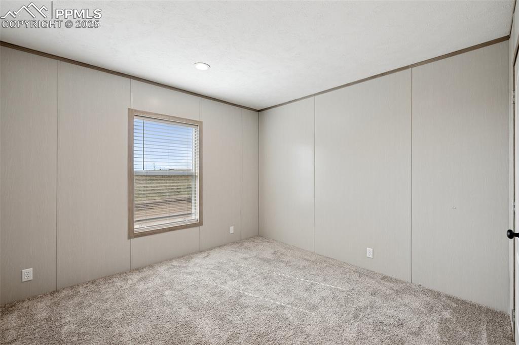 30495 Darroll Drive Yoder, CO 80864 - Photo 17 of 34 a view of an empty room with a window