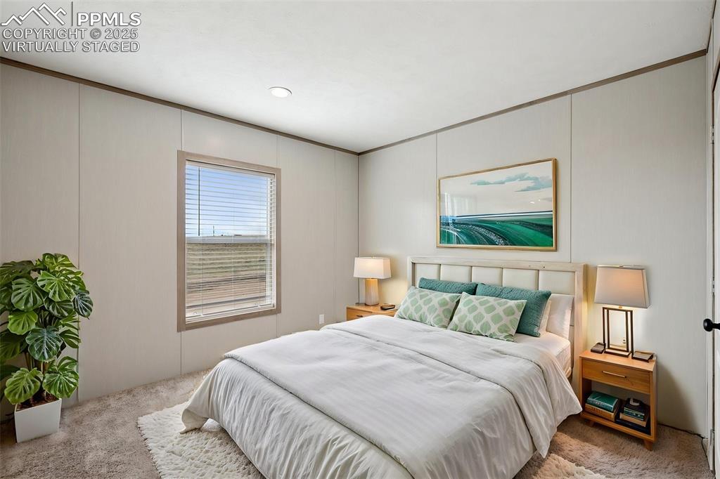 30495 Darroll Drive Yoder, CO 80864 - Photo 18 of 34 a bedroom with a bed and a window