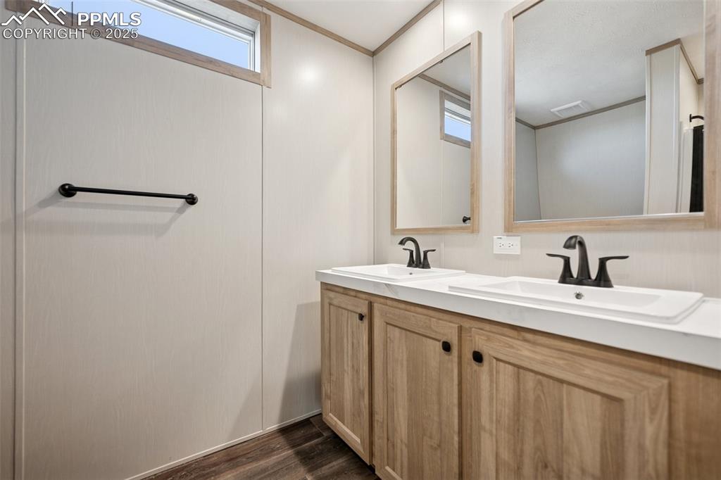 30495 Darroll Drive Yoder, CO 80864 - Photo 25 of 34 a bathroom with a sink and a mirror