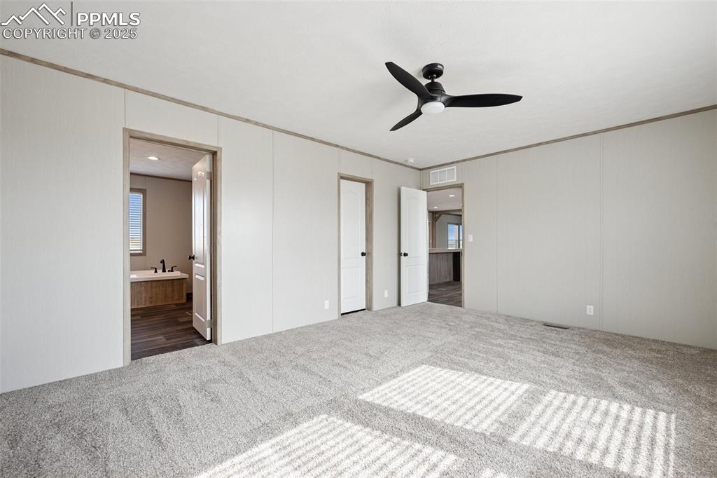 30495 Darroll Drive Yoder, CO 80864 - Photo 28 of 34 a view of a livingroom with a chandelier fan and a window