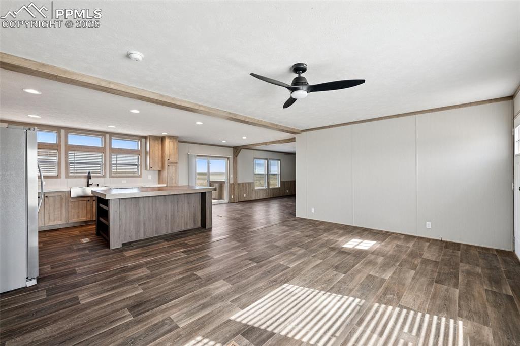 30495 Darroll Drive Yoder, CO 80864 - Photo 29 of 34 a large kitchen with a wooden floor and a large window