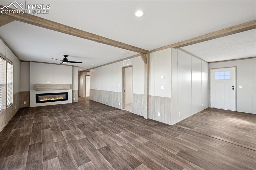 30495 Darroll Drive Yoder, CO 80864 - Photo 9 of 34 a view of empty room with wooden floor and window
