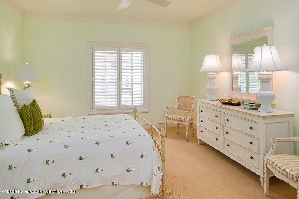 1630 Lands End Road Manalapan, FL 33462 - Photo 12 of 19 a bedroom with a bed and a dresser